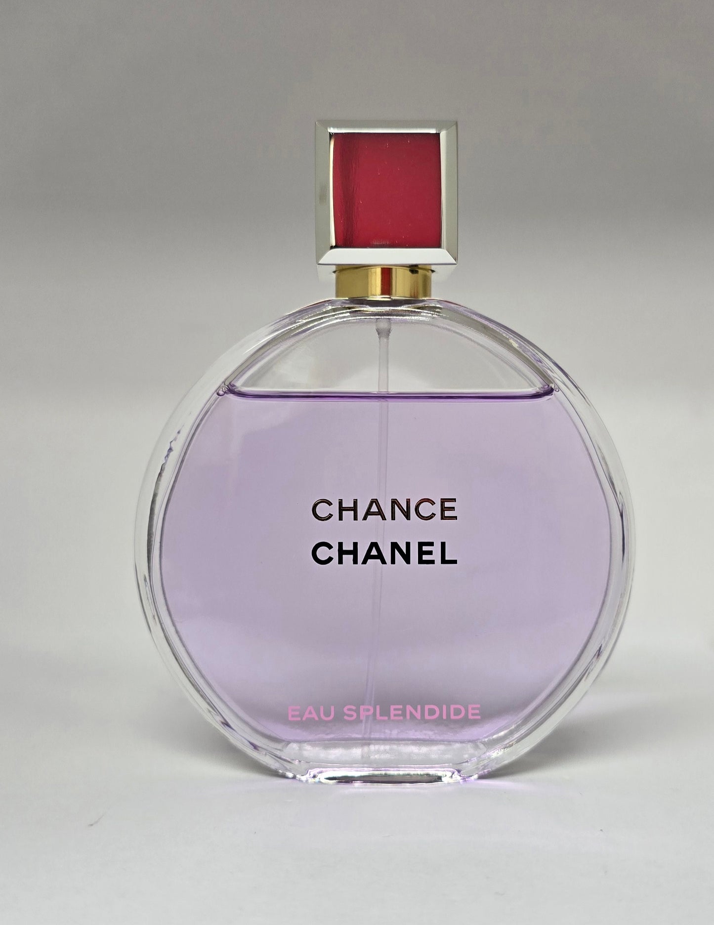 Chanel Chance perfume bottle on a gray background