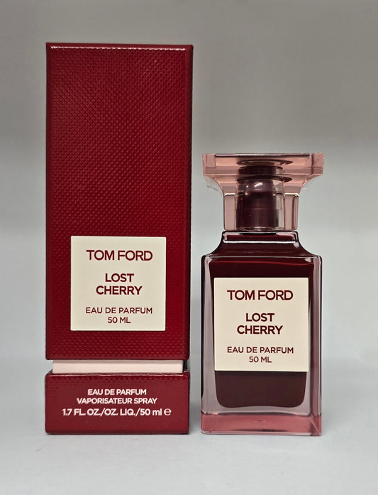 Tom Ford Lost Cherry perfume bottle and packaging on a gray background