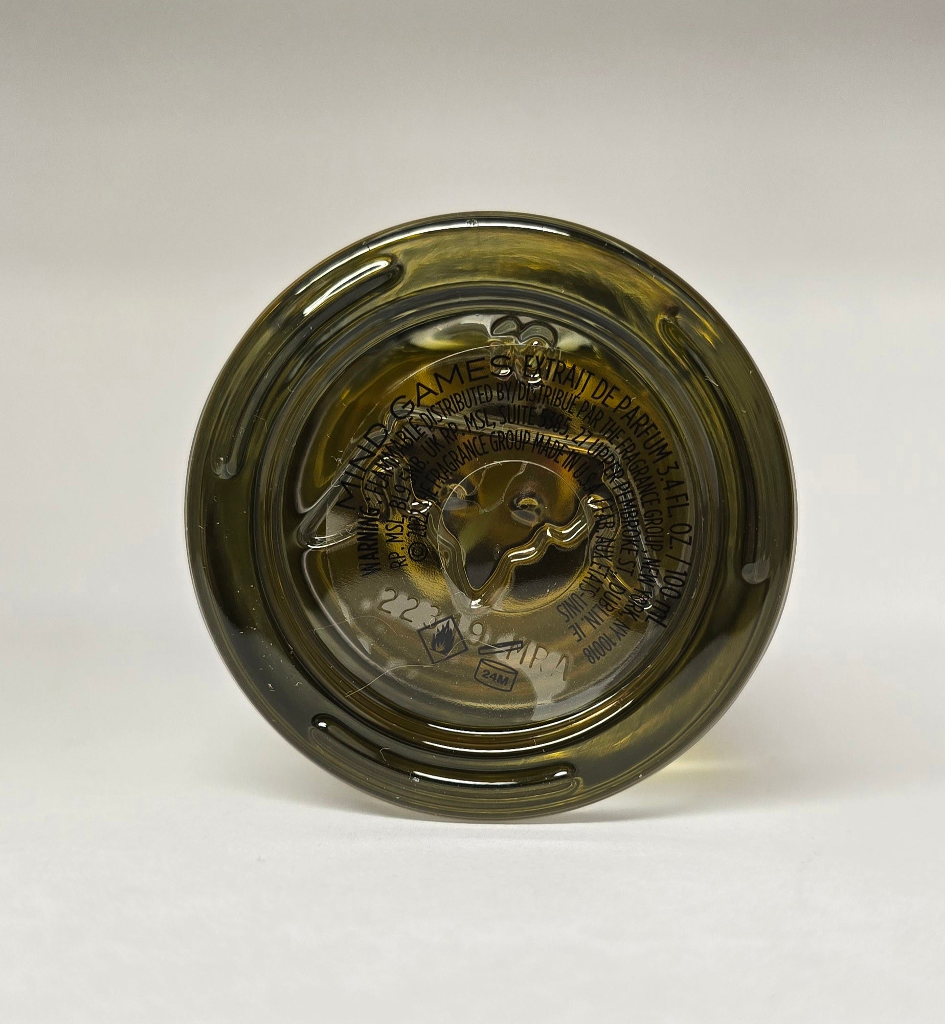 Glass ashtray with engraved design on a white background