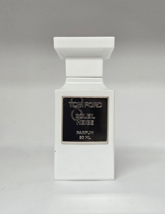 White Tom Ford perfume bottle with black label on a gray background
