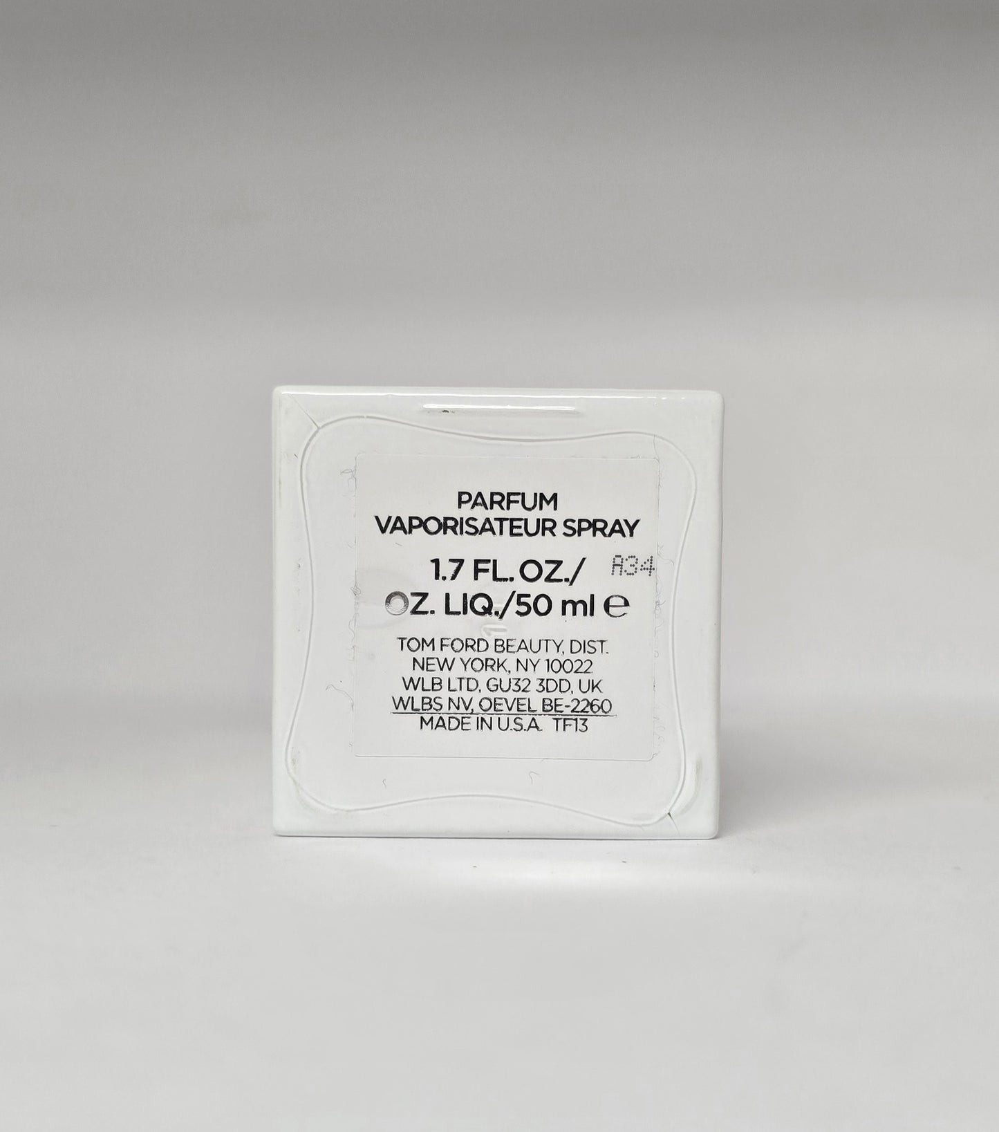 Tom Ford parfum packaging on a gray background