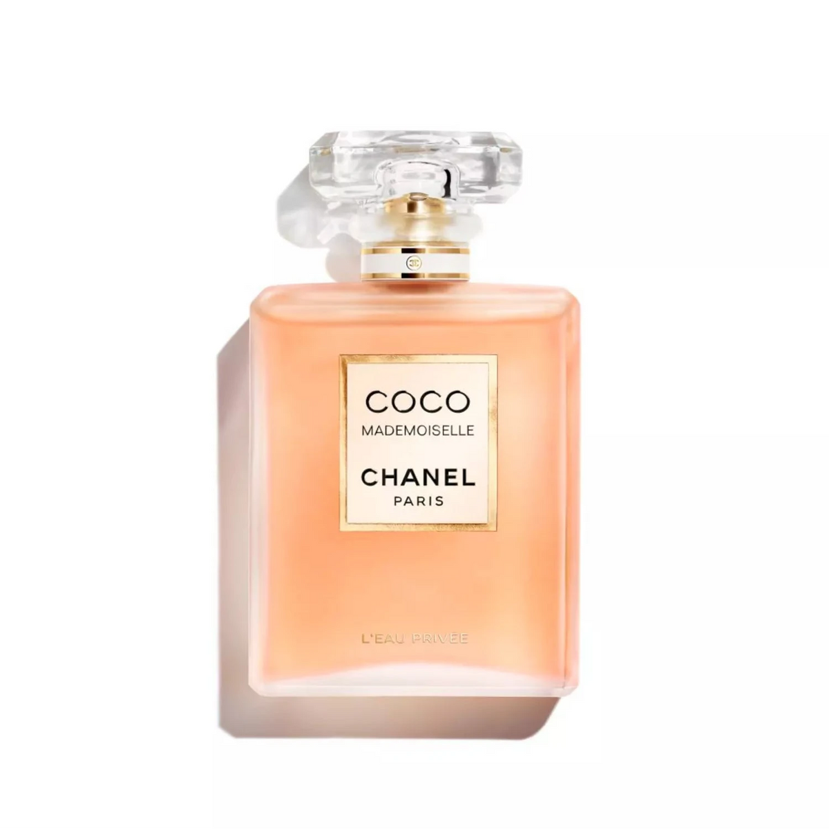 Chanel Coco Mademoiselle Eau de Parfum bottle in a peachy orange color, styled like the iconic original bottle, with a clear cap and gold lettering on a white background.