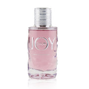 Dior JOY perfume bottle on a white background