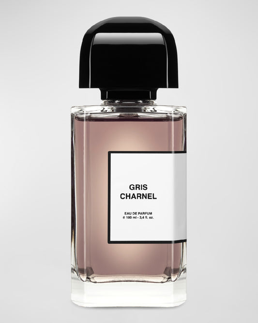 Perfume bottle labeled 'Gris Charnel' on a light gray background